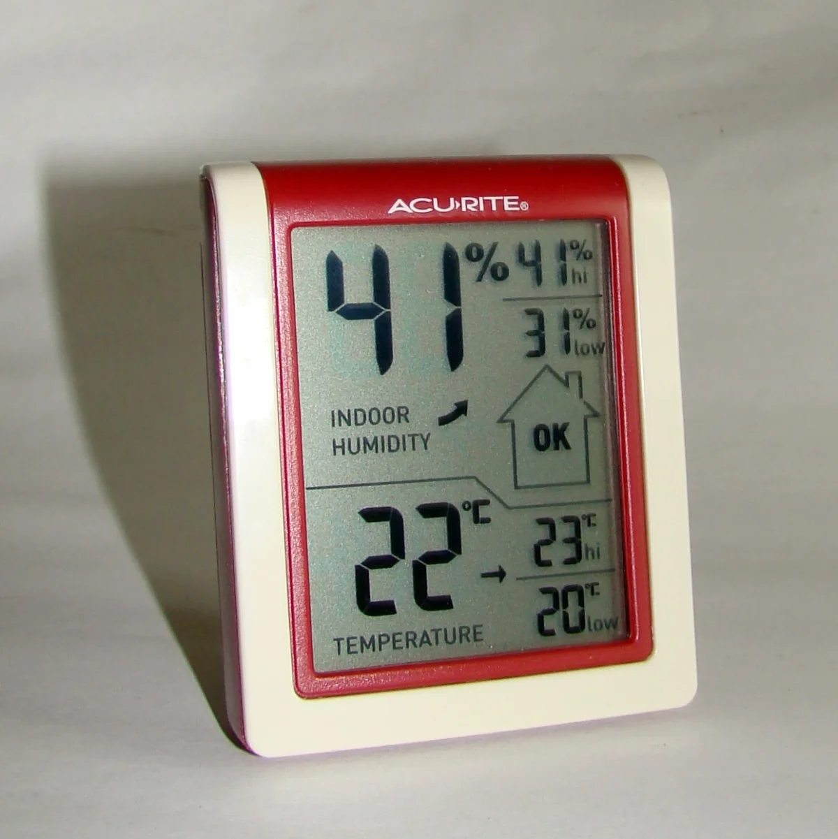 Dial thermo-hygrometer monitoring root cellar conditions at 43 degrees Fahrenheit and 90 percent relative humidity